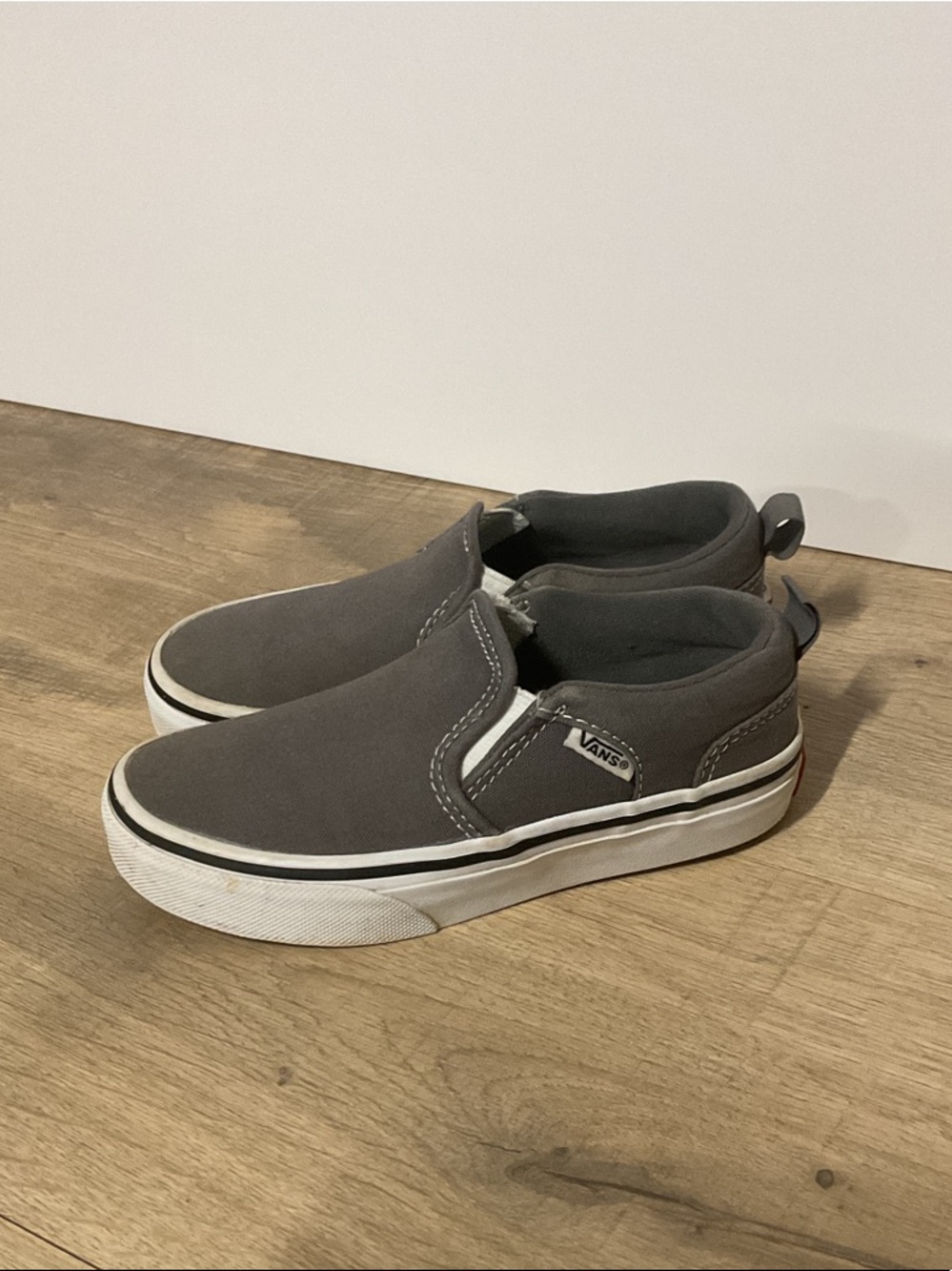 Vans Kids Slip-On Sneakers in Dark Gray and White